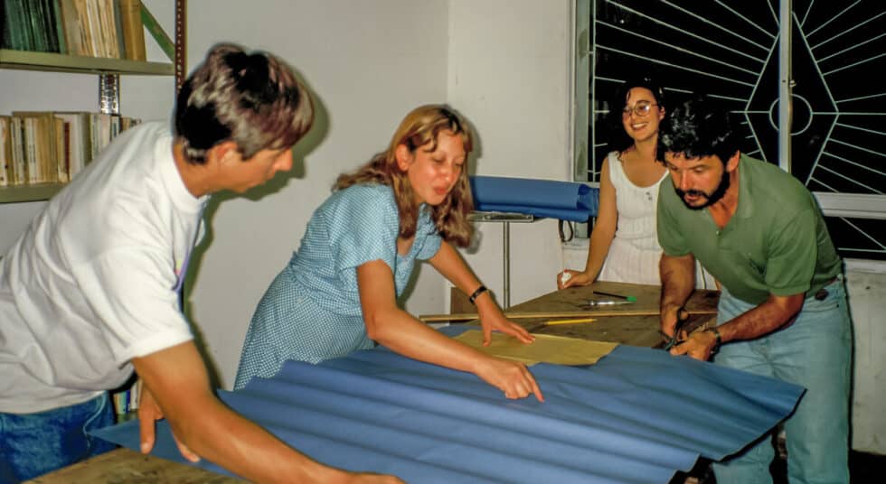 Four students in my business class working as a team during the Envelope Game. A Peace Corps volunteer’s story in Baltasar Brum, Uruguay.