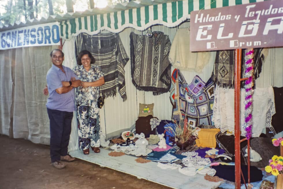 Elio and Elba standing by the crafts booth for Baltasar Brum. A Peace Corps volunteer’s story in Baltasar Brum, Uruguay.