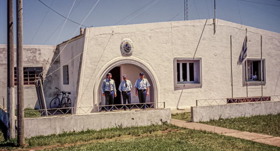Police station with three officers standing in the doorway. A Peace Corps volunteer’s story in Baltasar Brum, Uruguay.