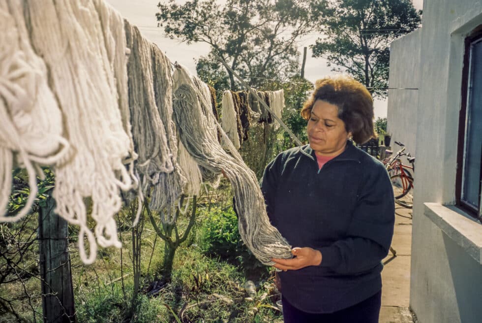 Elba inspecting yarn drying on line. A Peace Corps volunteer’s story in Baltasar Brum, Uruguay.